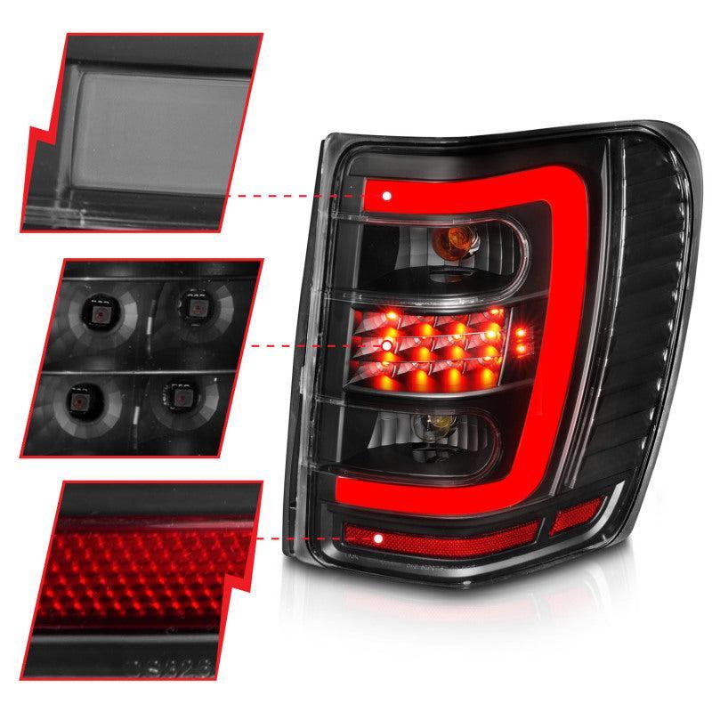 ANZO 1999-2004 Jeep Grand Cherokee LED Tail Lights w/ Light Bar Black Housing Clear Lens ANZO Tail Lights  AXOPROS