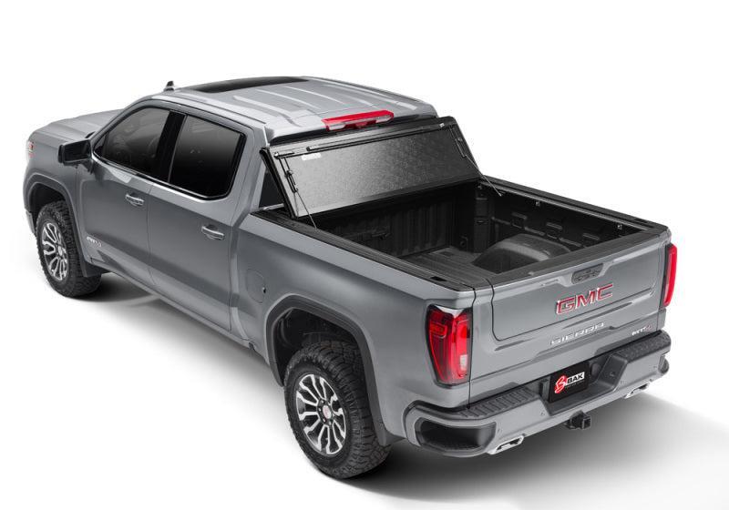 BAK 2020 Chevy Silverado 2500/3500 HD 6ft 9in Bed BAKFlip F1 BAK Tonneau Covers - Hard Fold AXOPROS
