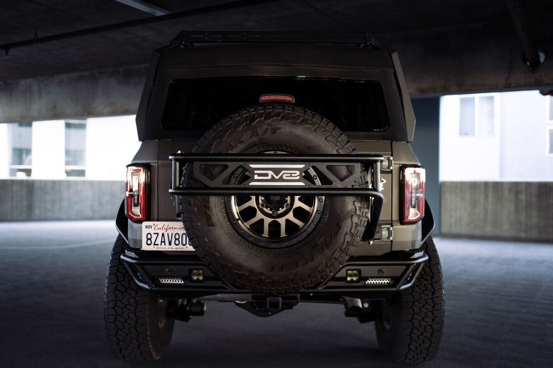 DV8 Offroad 21-23 Ford Bronco Spare Tire Guard & Accessory Mount DV8 Offroad Hitch Receivers  AXOPROS