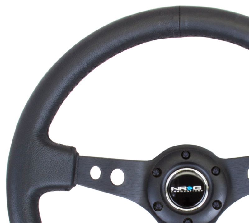 NRG Reinforced Steering Wheel (350mm / 3in. Deep) Blk Leather w/Blk Spoke & Circle Cutouts NRG Steering Wheels AXOPROS
