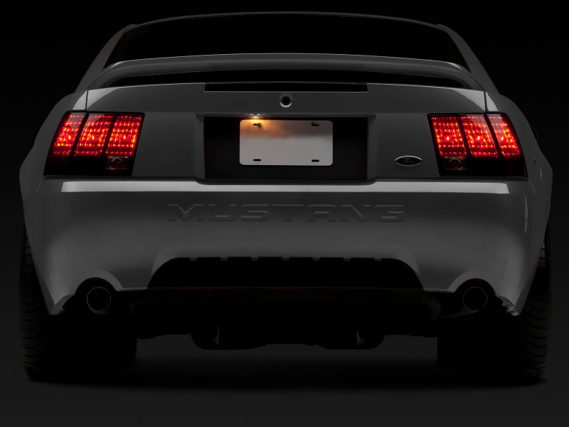 Raxiom 99-04 Ford Mustang Excluding 99-01 Cobra Tail Lights- Black Housing (Smoked Lens) Raxiom Tail Lights  AXOPROS
