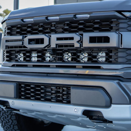 Baja Designs 2021+ Ford Raptor Squadron Sport Behind Grille Kit Baja Designs Light Bars & Cubes  AXOPROS