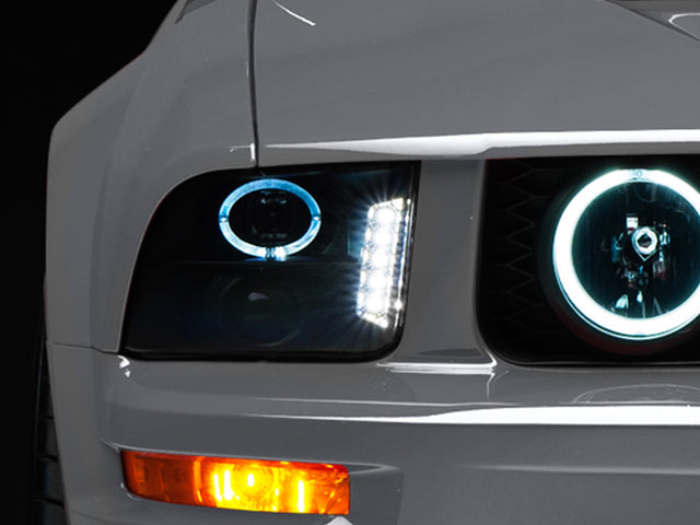 Raxiom 05-09 Ford Mustang w/ Halogen LED Halo Prjctr Headlights-Blk Hsng(Smoked Lens Exclude GT500) Raxiom Headlights  AXOPROS
