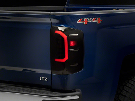 Raxiom Raxiom 14-18 Chevrolet Silverado 1500 Axial Series LED Tail Lights- Black Housing (Smoked Lens) Tail Lights aftermarket performance part