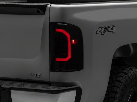 Raxiom Raxiom 07-14 Chevrolet Silverado 1500 Axial Series LED Tail Lights- Black Housing (Smoked Lens) Tail Lights aftermarket performance part