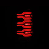 AlphaRex 14-18 GMC Sierra 1500/2500HD/3500HD LUXX-Series LED Tail Lights Alpha-Blk Actv Lgt Seq. Sig AlphaRex Tail Lights  AXOPROS