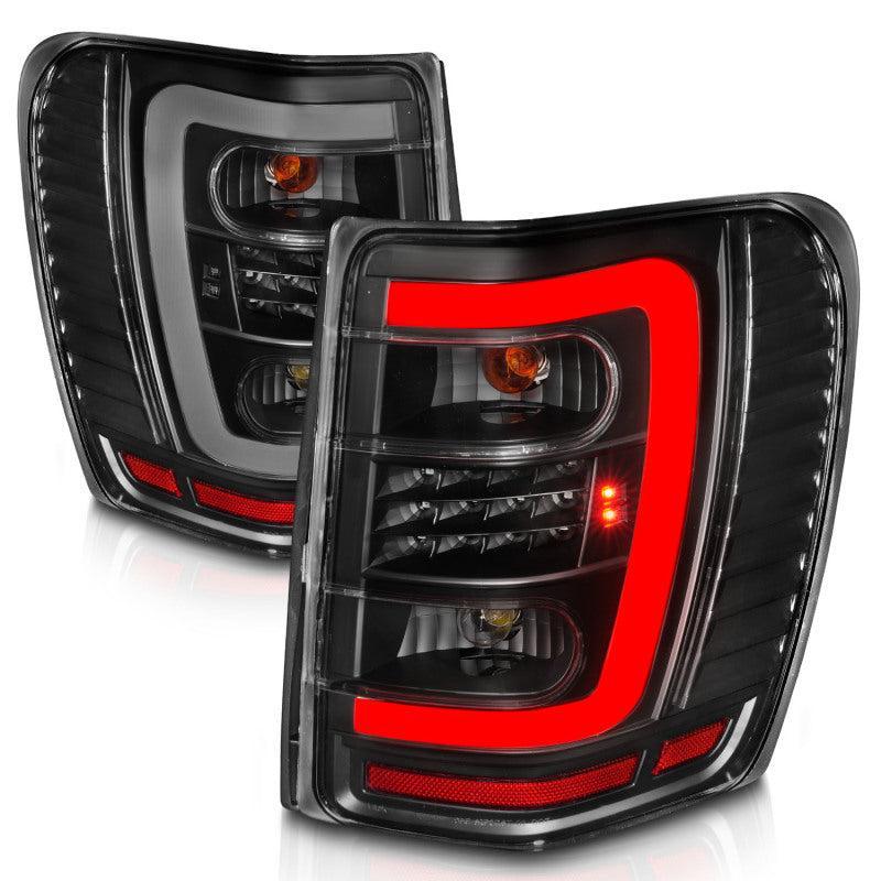 ANZO 1999-2004 Jeep Grand Cherokee LED Tail Lights w/ Light Bar Black Housing Clear Lens ANZO Tail Lights  AXOPROS