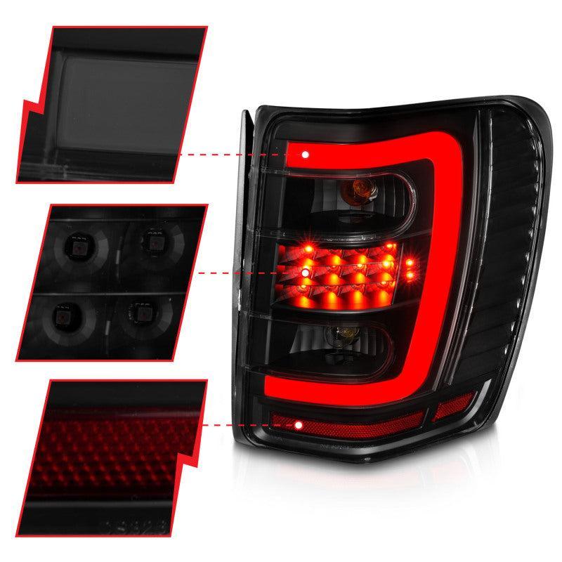 ANZO 1999-2004 Jeep Grand Cherokee LED Tail Lights w/ Light Bar Black Housing Smoke Lens ANZO Tail Lights  AXOPROS