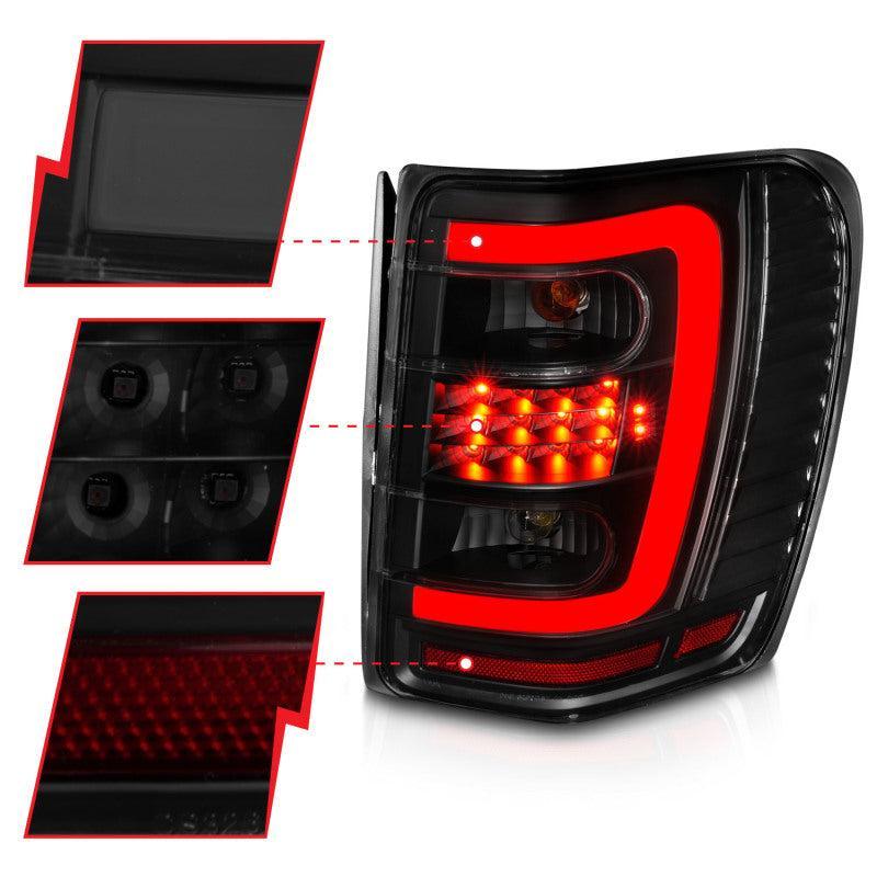 ANZO 1999-2004 Jeep Grand Cherokee LED Tail Lights w/ Light Bar Black Housing Smoke Lens ANZO Tail Lights  AXOPROS