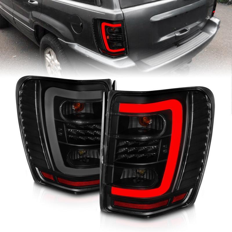 ANZO 1999-2004 Jeep Grand Cherokee LED Tail Lights w/ Light Bar Black Housing Smoke Lens ANZO Tail Lights  AXOPROS