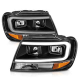 ANZO 99-04 Jeep Grand Cherokee Crystal Headlights - w/ Light Bar Black Housing ANZO Headlights  AXOPROS