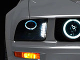 Raxiom 05-09 Ford Mustang w/ Halogen LED Halo Prjctr Headlights-Blk Hsng(Smoked Lens Exclude GT500) Raxiom Headlights  AXOPROS