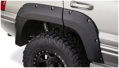 Bushwacker 99-04 Jeep Grand Cherokee Cutout Style Flares 4pc - Black Bushwacker Fender Flares  AXOPROS