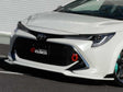 Cusco 19+ Toyota Corolla Hatchback Front Lip Spoiler (Primer/Unpainted) Cusco Lips & Splitters  AXOPROS