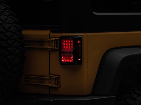 Raxiom Raxiom 07-18 Jeep Wrangler JK Axial Series Lux LED Tail Lights- Black Housing (Clear Lens) Tail Lights aftermarket performance part