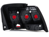 Raxiom 99-04 Ford Mustang Excluding 99-01 Cobra Tail Lights- Black Housing (Smoked Lens) Raxiom Tail Lights  AXOPROS